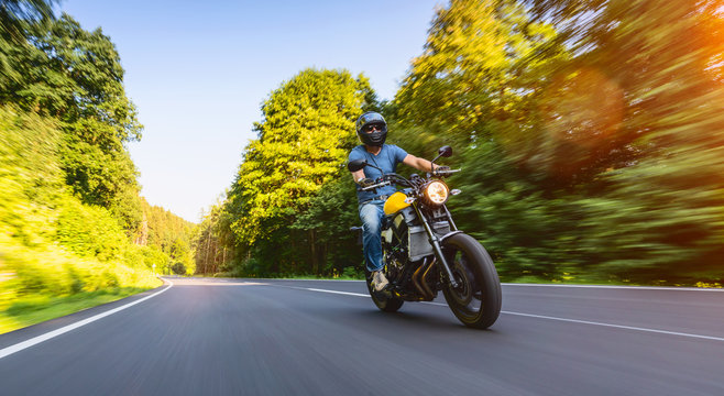 motorbike on the road riding. having fun riding the empty road on a motorcycle tour / journey