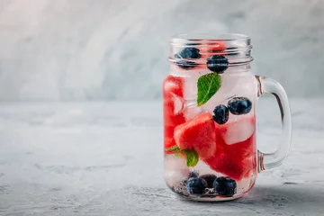 Keuken spatwand met foto Infused detox water with watermelon, mint and blueberry. © nblxer