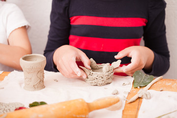 Child hands with plasticine