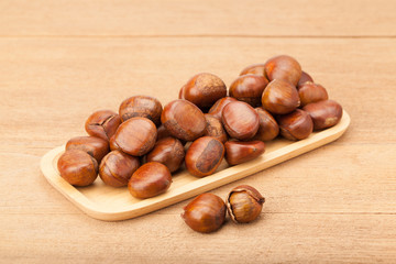 chestnut in wooden plate