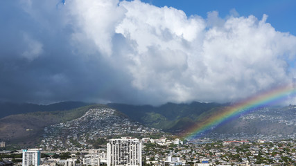 Views from Waikiki Beach resort towards the tropical rainforest known as Honolulu Watershed Forest Reserve and the developments of Manoa and Palolo, Oahu Island, Hawaii, USA