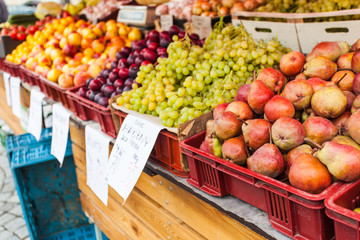 Boxes with fresh juicy fruit on the counter.