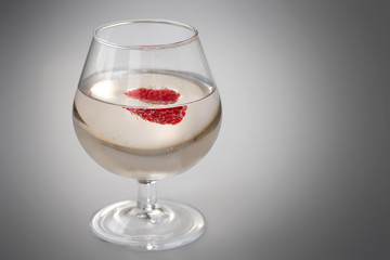 Champagne glass with raspberry.