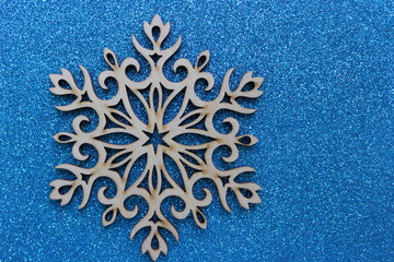 Large beautiful snowflake on a brilliant blue background