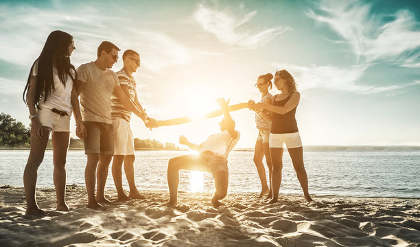 Happiness Friends funny game on the beach under sunset sunlight