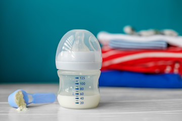 Artificial nutrition in a plastic bottle. Concept of newborns, motherhood, care, lifestyle.