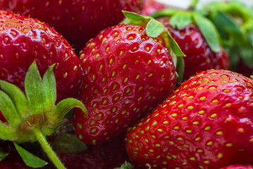 Several ripe strawberries. Close-up photo. Summer fruits