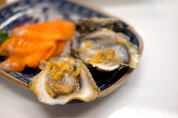 Tasty fresh oysters on plate.
