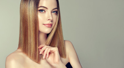 Beautiful model girl with shiny brown and straight long  hair .Keratin  straightening .Treatment,...