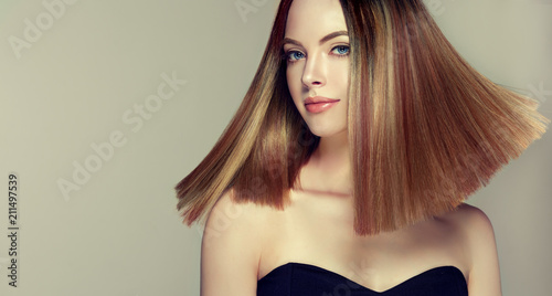 Beautiful Model Girl With Shiny Brown And Straight Long Hair