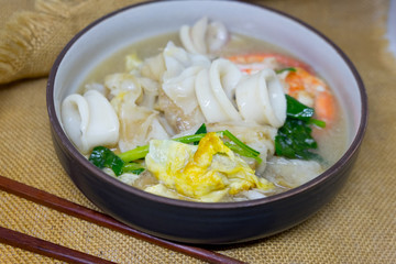 Wide noodles in a creamy gravy sauce