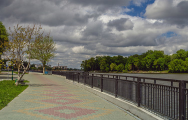 Embankment in the park in stormy weather.