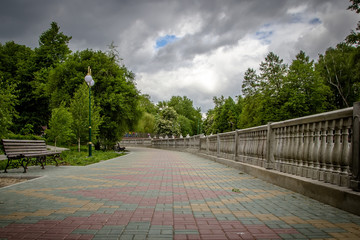 Embankment in the park in stormy weather.