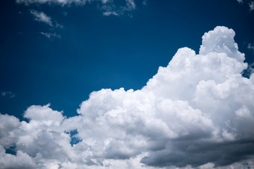 Naklejka na ściany i meble Blue sky with white clouds.Bright blue sky with fluffy clouds on a sunny day.