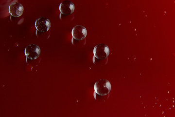 The abstract  crystal ball on red glossy floor background.