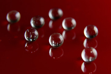 The abstract  crystal ball on red glossy floor background.