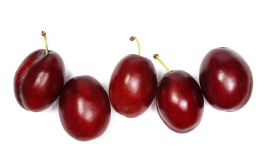Fresh plums isolated on white background