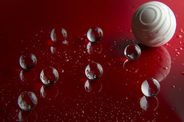 The abstract  crystal ball on red glossy floor background.