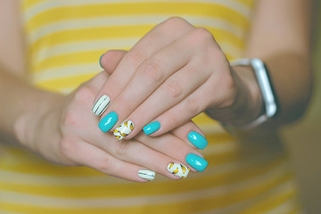 manicure bananas nail art yellow, blue, turquoise, white, black strips, two hands