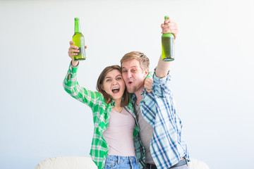 Soccer world cup concept - Young friends drink beer and cheering for football