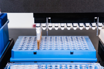 Automation in the clinical laboratory. Pipetting robot laboratory. Medicine robotics. NGS DNA diagnostics. Research and science background