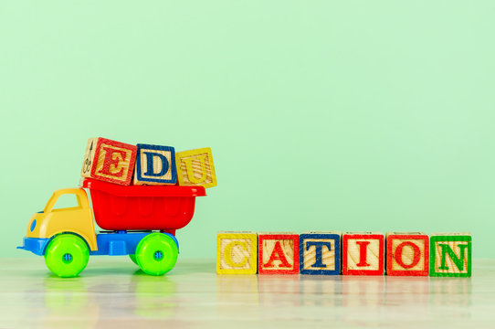 Colorful toy truck with alphabet blocks arrangement of Education. Pre school, back to school concept.