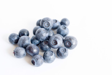 Forest blueberries on a white background close up, soft focus. Summer wild berry
