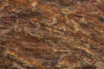Texture of granite stone. Natural mountain stone. Rusty texture shades