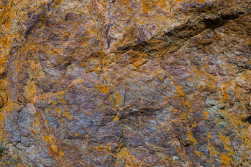 Texture of granite stone. Natural mountain stone. Rusty texture shades