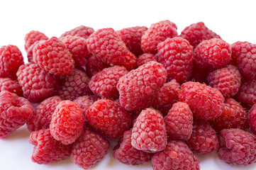 Background of raspberries. Fresh raspberries closeup. Top view. Ripe raspberries on white background. 