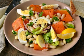 Salad with beans, egg, carrot and apple