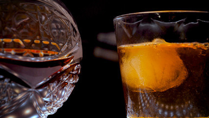 Decanter and a glass of whiskey with ice