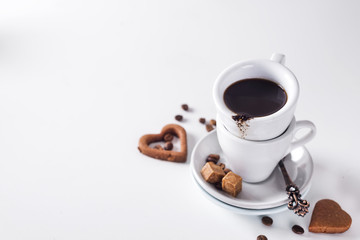 Coffee cup and beans on a white background.