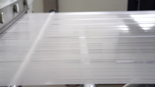 The polypropylene extruder with a flat slit nozzle is heated to 260 &deg;C. Fabrication and winding of flat thread. Thin film after cooling is cut into flat threads of the required thickness