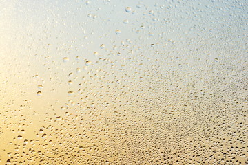 Rain drops and frozen water on window glass background