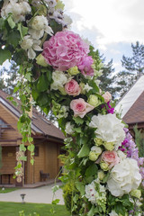 Wedding ceremony arch decoration with beautiful flowers.