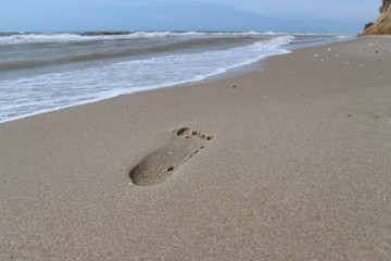 footprint on the sand on the sea beach