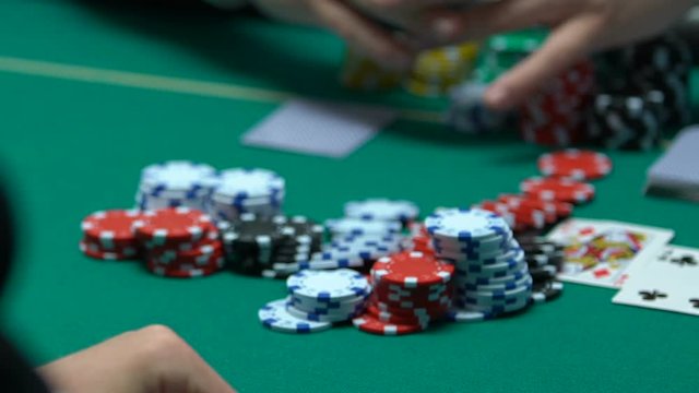 Self-confident poker player making big bets, goes all-in, hope for fortune