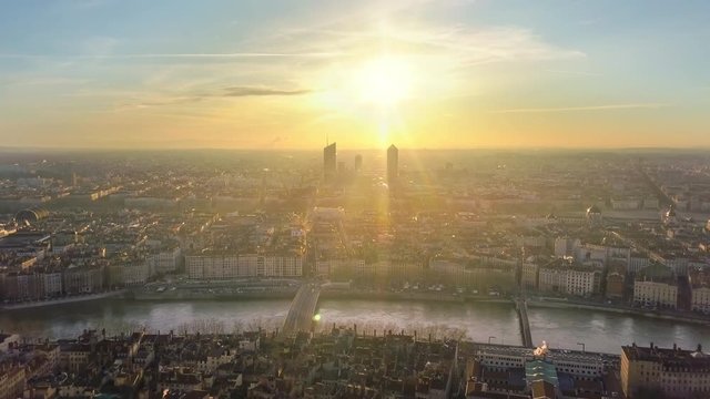 lyon city skyline aerial shot at sunrise flight backwards over city