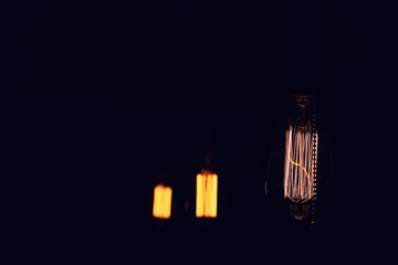 Lamps with tungsten filament. Edison's light bulb. Filament fila