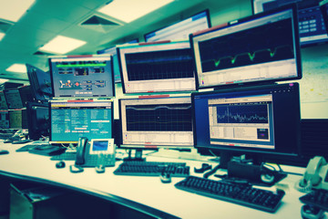 System Control Room IT with many monitor  in a High-Tech Facility That Works on the Surveillance,...