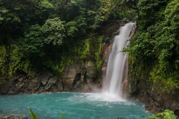 Fototapeta na wymiar Rio Celeste waterfall in the forest