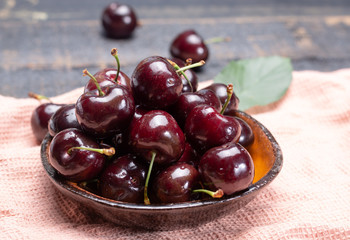 Giant fresh ripe black cherries, new harvest, ready to eat close up