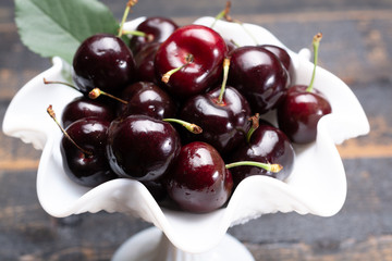 Giant fresh ripe black cherries, new harvest, ready to eat close up