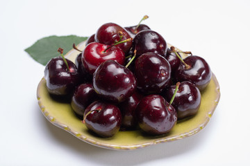 Giant fresh ripe black cherries, new harvest, ready to eat close up