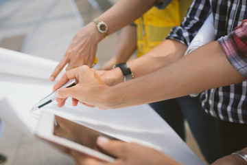 Close up of hand engineer meeting for architectural project working with partner and engineering...