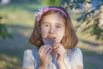 the child is eating chocolate