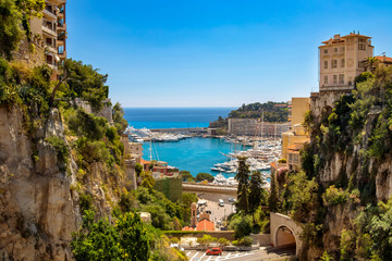 View of Monaco City with boat marina below in Monaco. Monaco City is one of the four traditional quarters. - obrazy, fototapety, plakaty