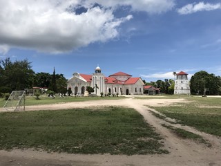 Fototapeta na wymiar St Augustine's Church and watchtower in Poblacion, Panglao island, Bohol, Philippines