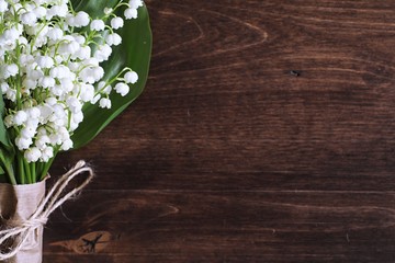 Bouquet of lilies of the valley on a table